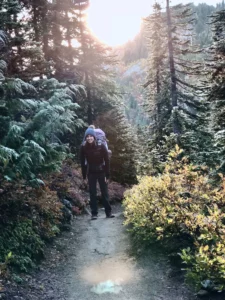 solo female traveler backpacking hiking forest