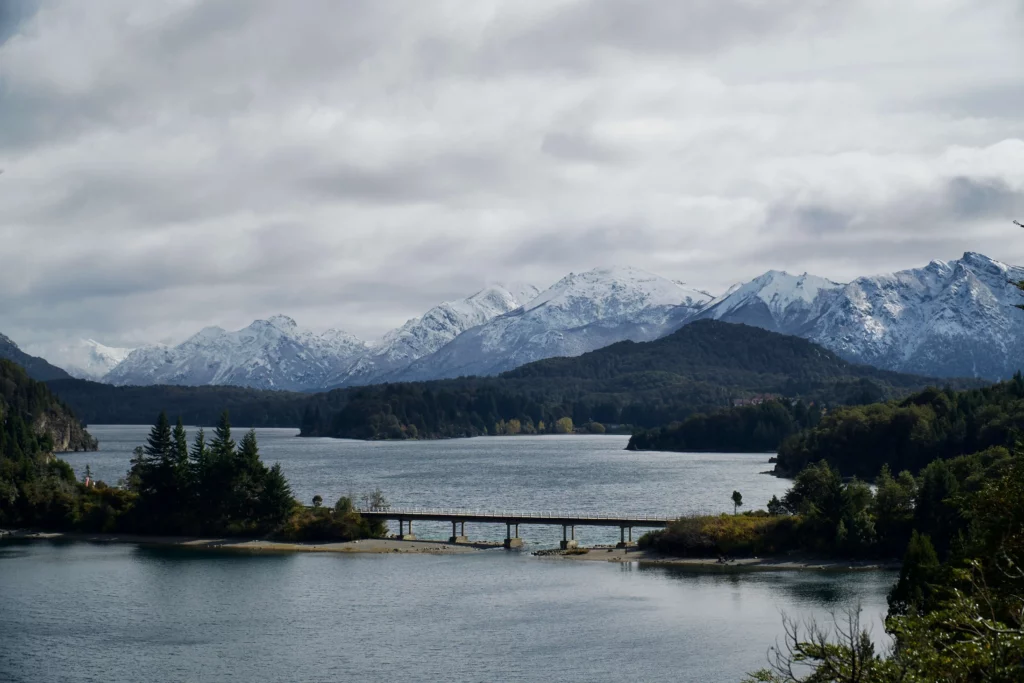 bridge over lake in patagonia andes mountain range 