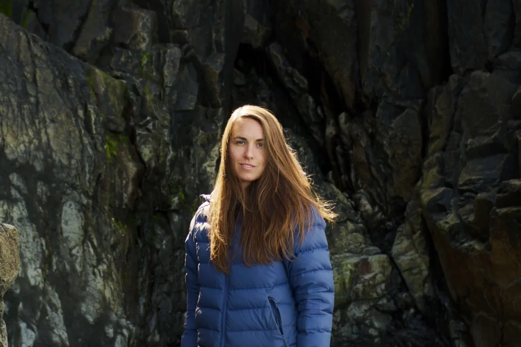brooke on foot wearing blue puffy coat