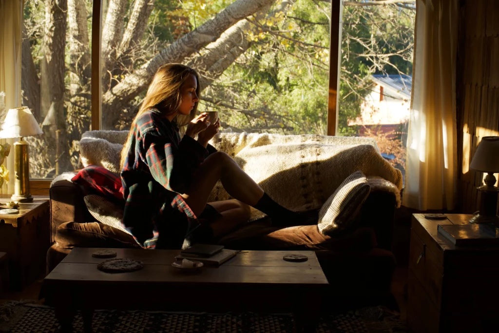 brooke on foot in cabin couch