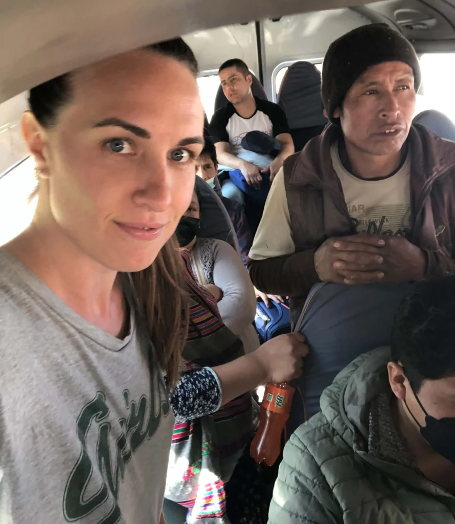 solo female traveler riding in colectivo with peruvians