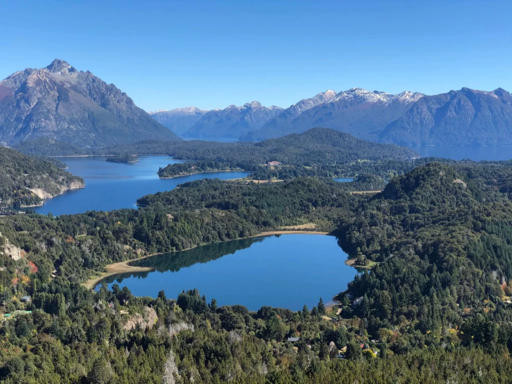 lakes surrounded by forest and andes mountains